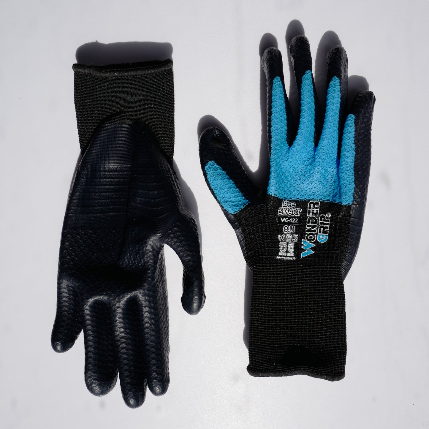 Bee-Smart™ lightweight gardening gloves with breathable black knit liner, blue textured grip coating on palm and fingers, designed for flexible garden and outdoor work.