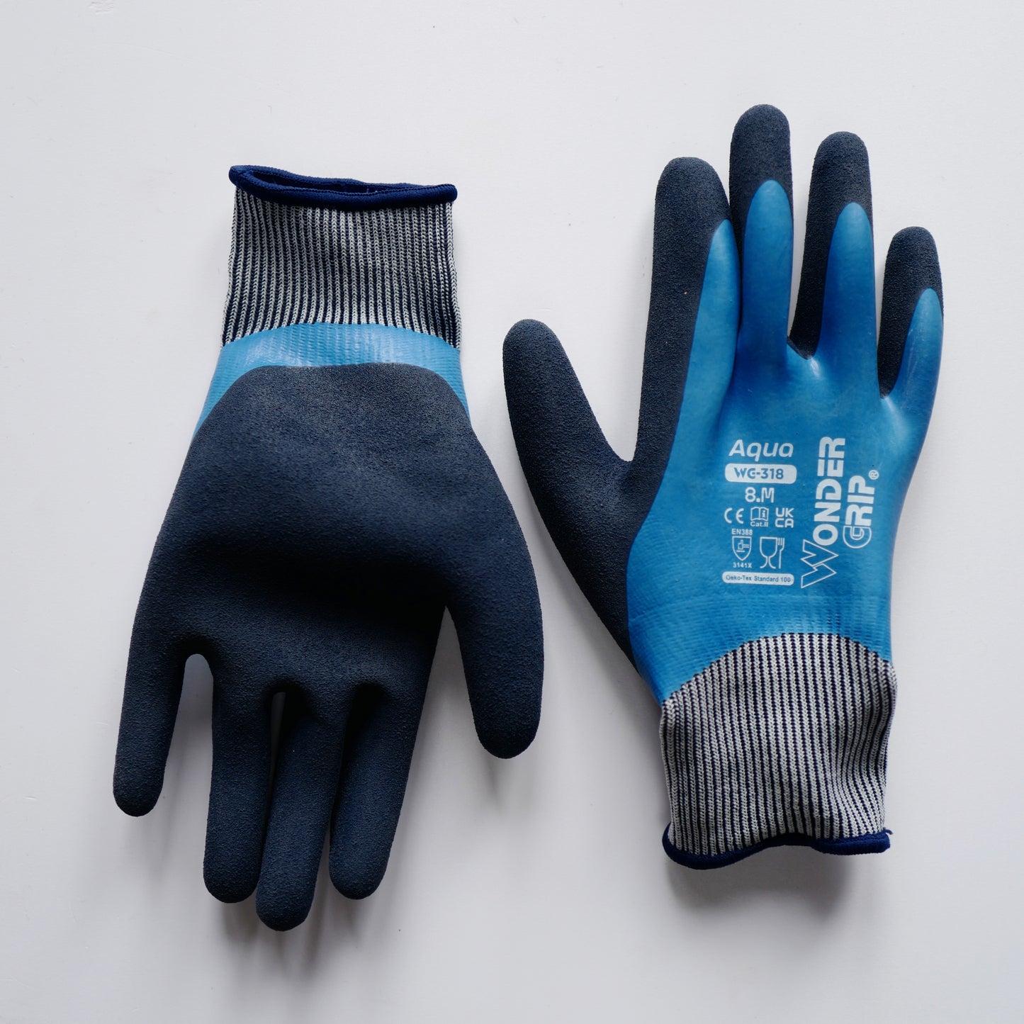 Waterproof gardening gloves with blue latex-coated palm and fingers, textured black grip, cushioned palm, and flexible knit wrist for wet outdoor work.
